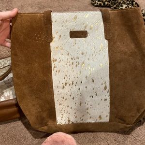 Super cute cowskin purse.